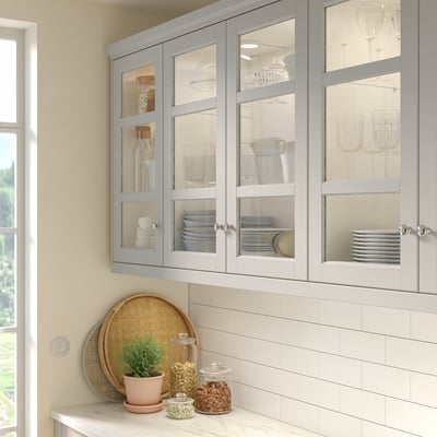 Grey kitchen cabinets with birch frames and bevelled glass.