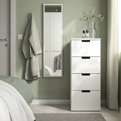 Modern white mirror & storage cabinet in bedroom.