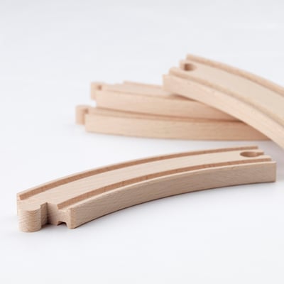 High-quality wooden train tracks neatly arranged. Smooth, natural finish, crafted from solid beech.