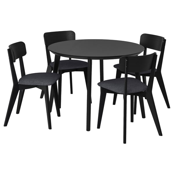 Black round dining table with four matching chairs, sleek design, hardwood materials.