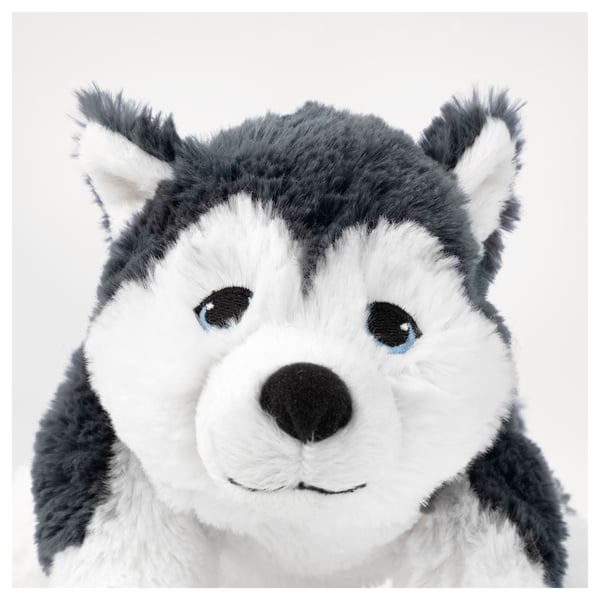 Stuffed husky pup with bright blue eyes & soft white, grey fur. Appears well-made, cuddly & safe.
