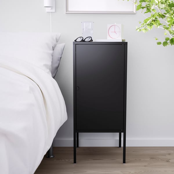 Black LIXHULT cabinet by bed, modern, fits small spaces, steel finish, versatile door, top shelf.