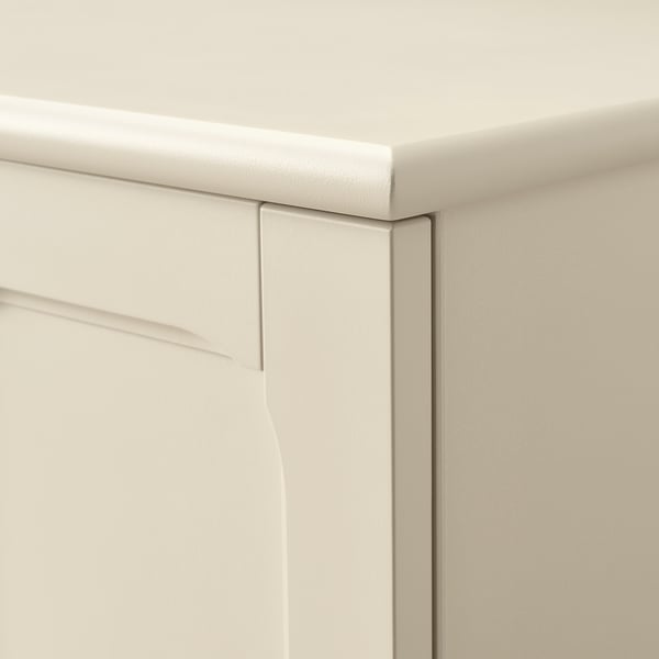Smooth, white cabinet corner with clean edges and soft-close hinge detail.