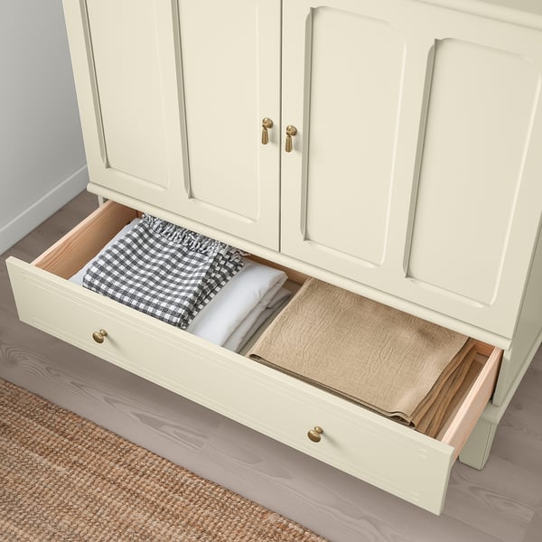 Open drawer of white LOMMARP cabinet displays folded towels, demonstrating soft-close functionality.