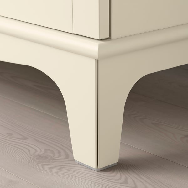 Modern storage cabinet with sleek, curved legs and panel, showcasing quality craftsmanship and design.