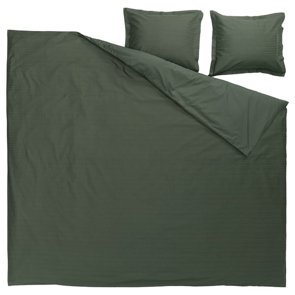 Dark green waffle-weave duvet set with pillows, made from 100% soft cotton.