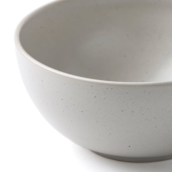 Rustic bowl with black dots.