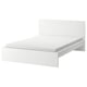 A white MALM bed with a simple, modern design and a high headboard. The bed is empty, with no bedding or pillows.