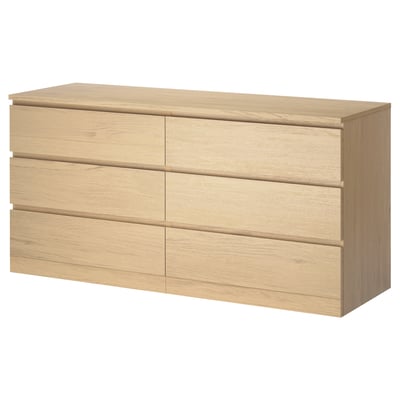 An oak MALM chest of drawers with six smooth-running drawers, a clean and minimalist design ideal for bedroom storage.