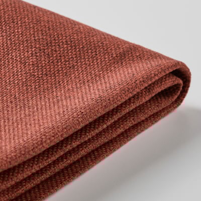 Close-up of rolled brownish-red fabric, smooth and woven texture.