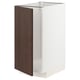 A white METOD kitchen cabinet with a dark brown wood veneer door. It modern design with snap hinges.