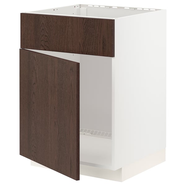 A dark brown ikea METOD kitchen cabinet with a white frame and oak veneer. It a half-open door, revealing the interior storage space.