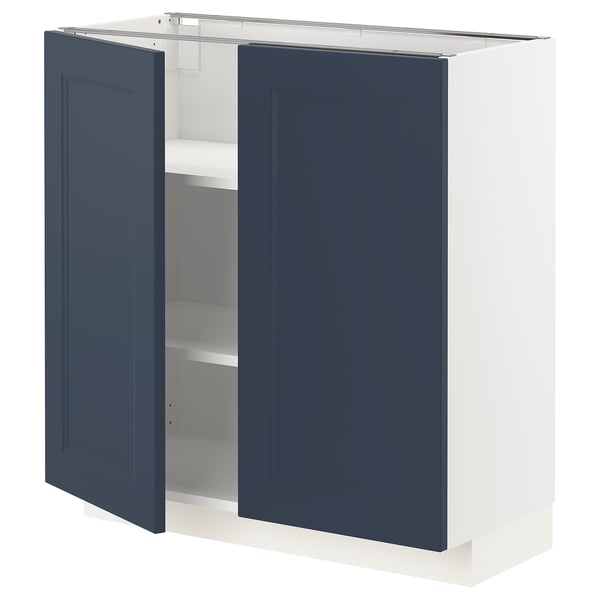 METOD kitchen cabinet in blue with two doors open, white frame, adjustable shelves.