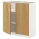 A METOD cabinet with light oak doors and a white base. It has two adjustable shelves inside.