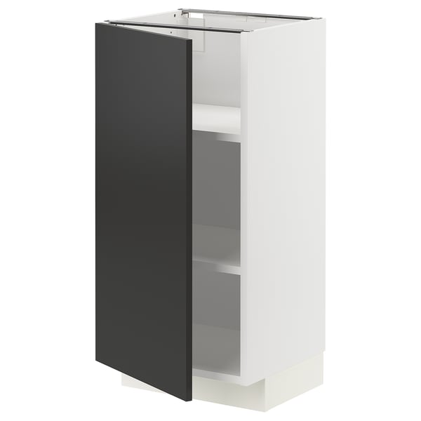 A modern kitchen cabinet, METOD in white with a black door. It has two shelves inside and a sleek, minimalist design.