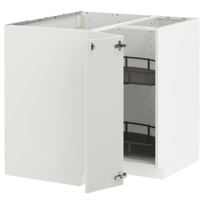 A white METOD kitchen cabinet with a glass door and metal shelves.