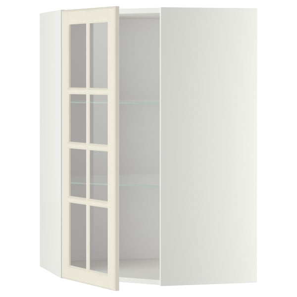 A white METOD kitchen corner cabinet with glass doors, featuring a traditional design with adjustable shelves.