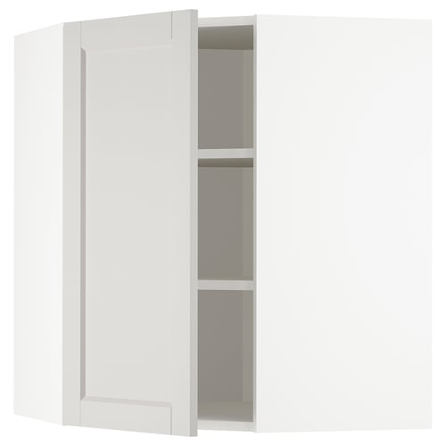 Open white kitchen cabinet with 3 shelves.