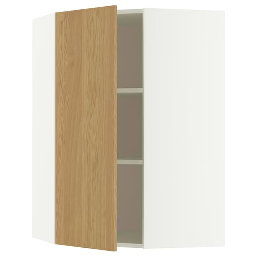 An open METOD corner cabinet with a light oak finish. It a door and shelves made of particle and fiberboard with a modern, minimalist design.