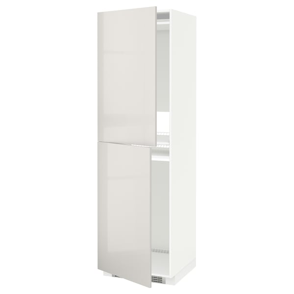 A white METOD kitchen cabinet with a glossy finish and two doors. It a sleek, modern design with adjustable shelves.