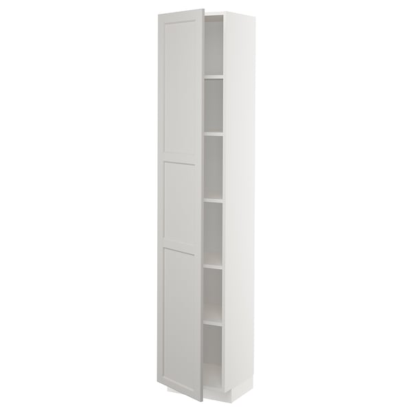 A white METOD kitchen cabinet with soft-close hinges and multiple adjustable shelves.