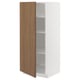 Open white METOD kitchen cabinet with walnut door, adjustable shelves.