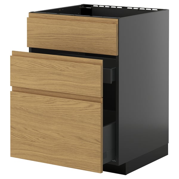 A modern kitchen unit named METOD with a dark grey body and oak-colored wooden drawers. It has three drawers, with the top one open.