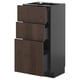 Dark brown METOD kitchen cabinet with wooden edging and three open drawers.