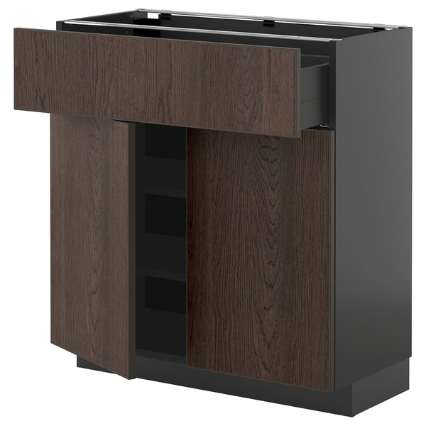 Dark brown METOD kitchen unit with wooden drawer and shelves.
