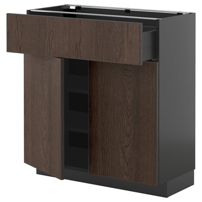 Dark brown METOD kitchen unit with wooden drawer and shelves.
