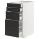 This image shows a white METOD kitchen cabinet with four black drawers, made of recycled materials for eco-friendly design.