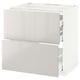 White modern kitchen unit with multiple drawers, glossy finish.