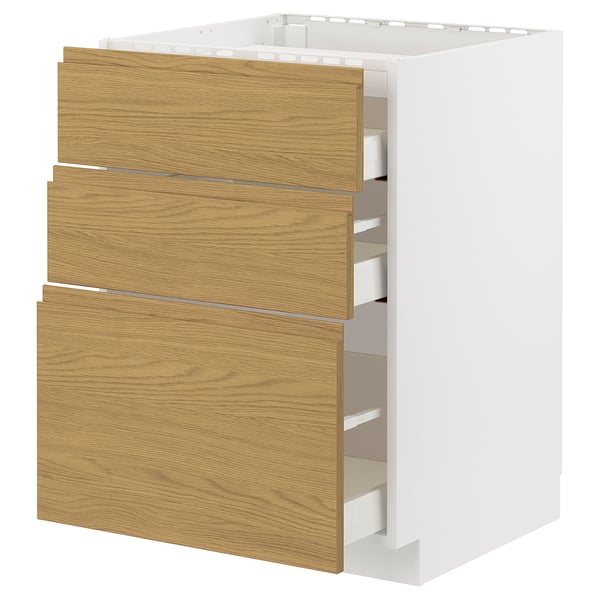 White kitchen unit with wooden drawers. Three large wooden drawers on a white base.