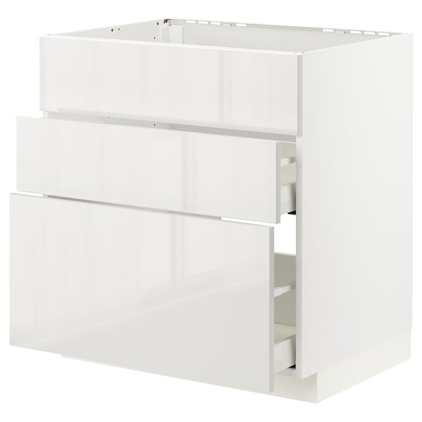 White METOD kitchen cabinet with three open drawers, glossy finish, rectangular shape.