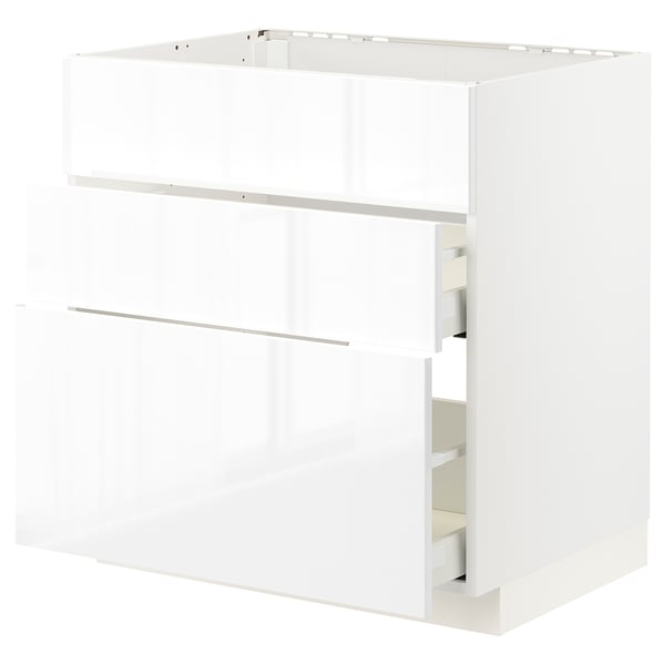 White METOD kitchen cabinet with glossy finish and pull-out shelves.