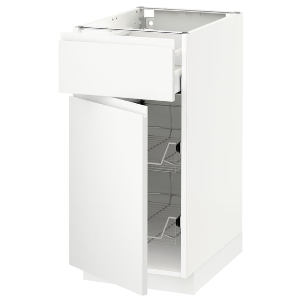 White METOD cabinet with pull-out drawer, minimalist design, integrated handles, wire baskets inside.