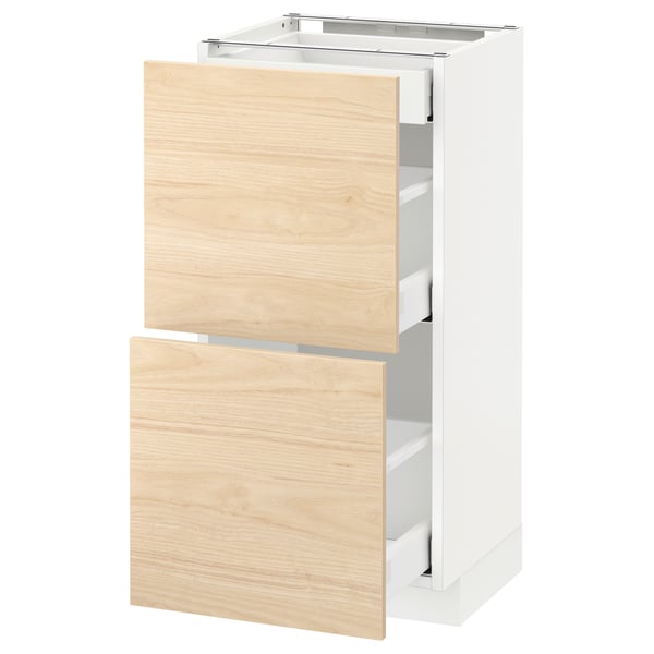 White ikea METOD kitchen cabinet with 2 ash wood drawers, partially open, sleek modern design.