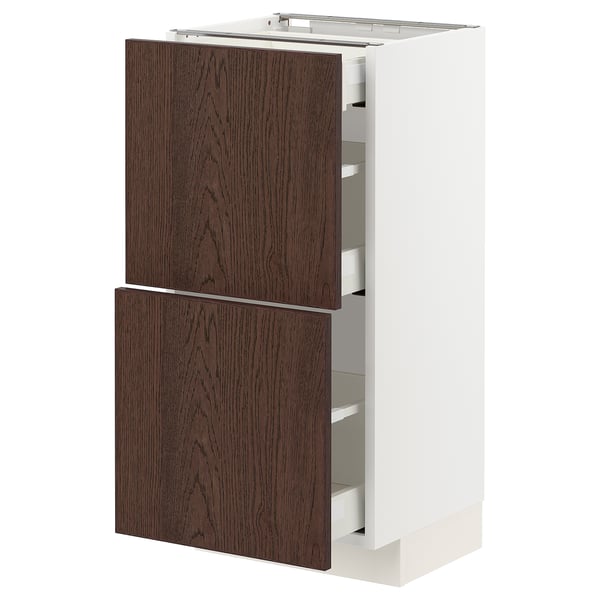 METOD kitchen cabinet with dark brown wood drawers and white frame.