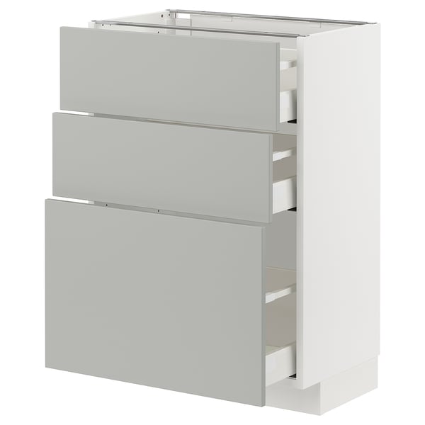 Modern white METOD kitchen unit with three grey drawers and sleek handles.