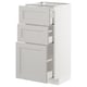 White METOD kitchen unit with beveled edges and multiple drawers for storage.