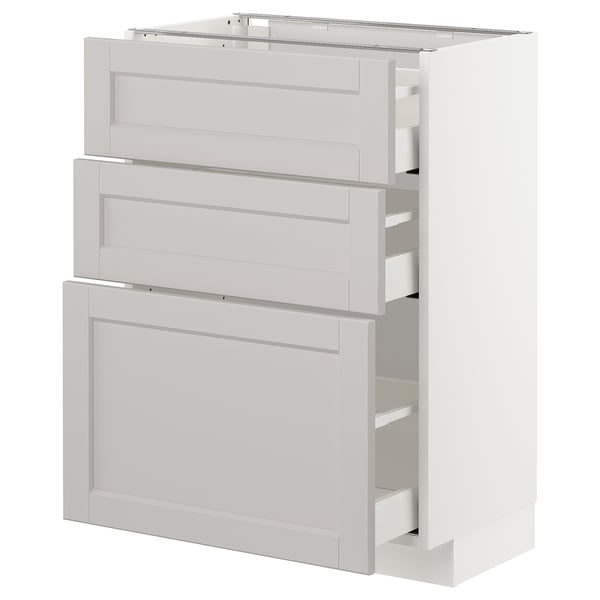 White METOD kitchen unit with bevelled drawers and shelves.