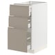 Ikea METOD kitchen cabinet. Three beige drawers with integrated handles. White frame, sleek design.
