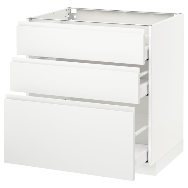 A modern white METOD kitchen cabinet with three drawers. The cabinet has a sleek, minimalist design with integrated handles.