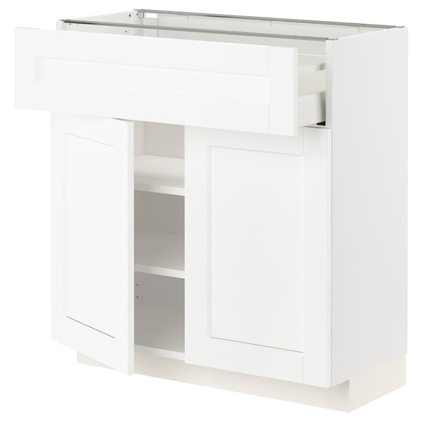 White METOD kitchen cabinet with shelves and drawer.