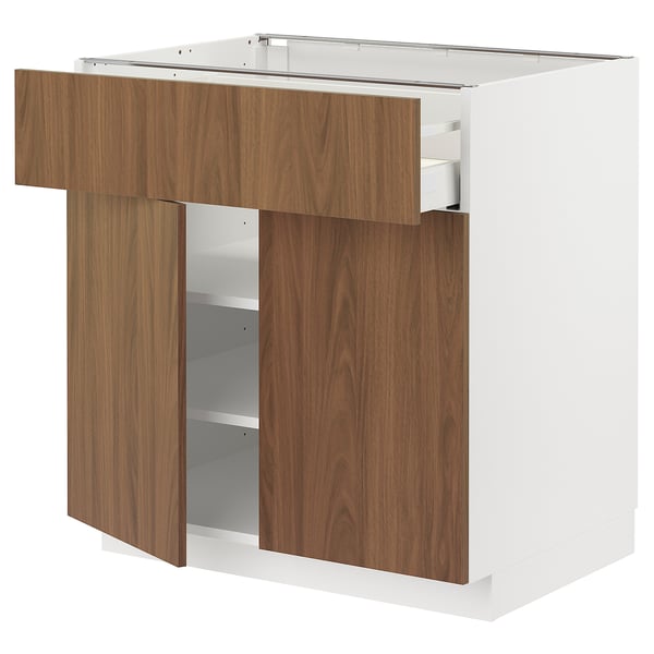 Modern kitchen cabinet, white and walnut. Open drawer and shelves, sturdy design.