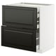 Black and white kitchen cabinet with drawers, sleek design, modern look. Part of the METOD system, durable materials.