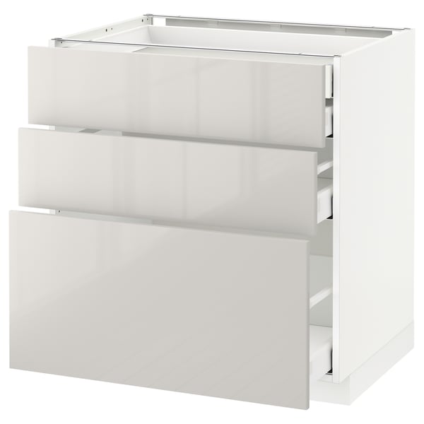 Modern white kitchen cabinet with sleek, glossy finish and smooth-running drawers.