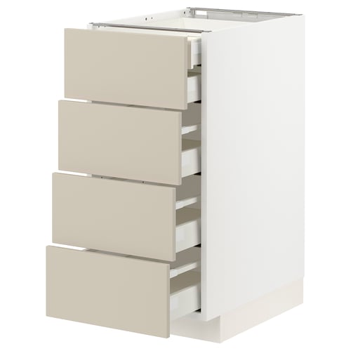 METOD kitchen unit with beige drawers, white cabinet, four full-extension drawers.