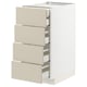 METOD kitchen unit with beige drawers, white cabinet, four full-extension drawers.