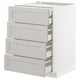 White METOD kitchen unit with four grey drawers, bevelled edges, and built-in dampers.